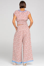 A model wearing the Desi Cotton Top in colour Paradise, from the back