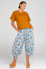 A model wearing the Haven Cotton Top in colour Mustard, from the front, showing the whole outfit