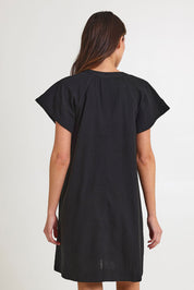 Model Madeline wearing size 10 of the Livy Cotton Dress in colour Black (Black), from the back