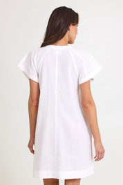 Model Madeline wearing size 10 of the Livy Cotton Dress in colour White (White), from the back