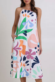 Model Madeline wearing size 10 of the Aria Cotton Dress in colour Sorrento, from the front, cropped image
