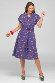 A model wearing the Amalfi Cotton Dress in colour Amalfi (Blue), from the front, showing the whole outfit