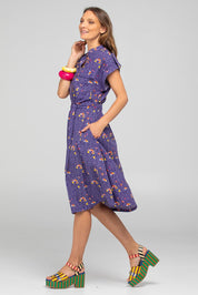 A model wearing the Amalfi Cotton Dress in colour Amalfi (Blue), from the front, showing the whole outfit