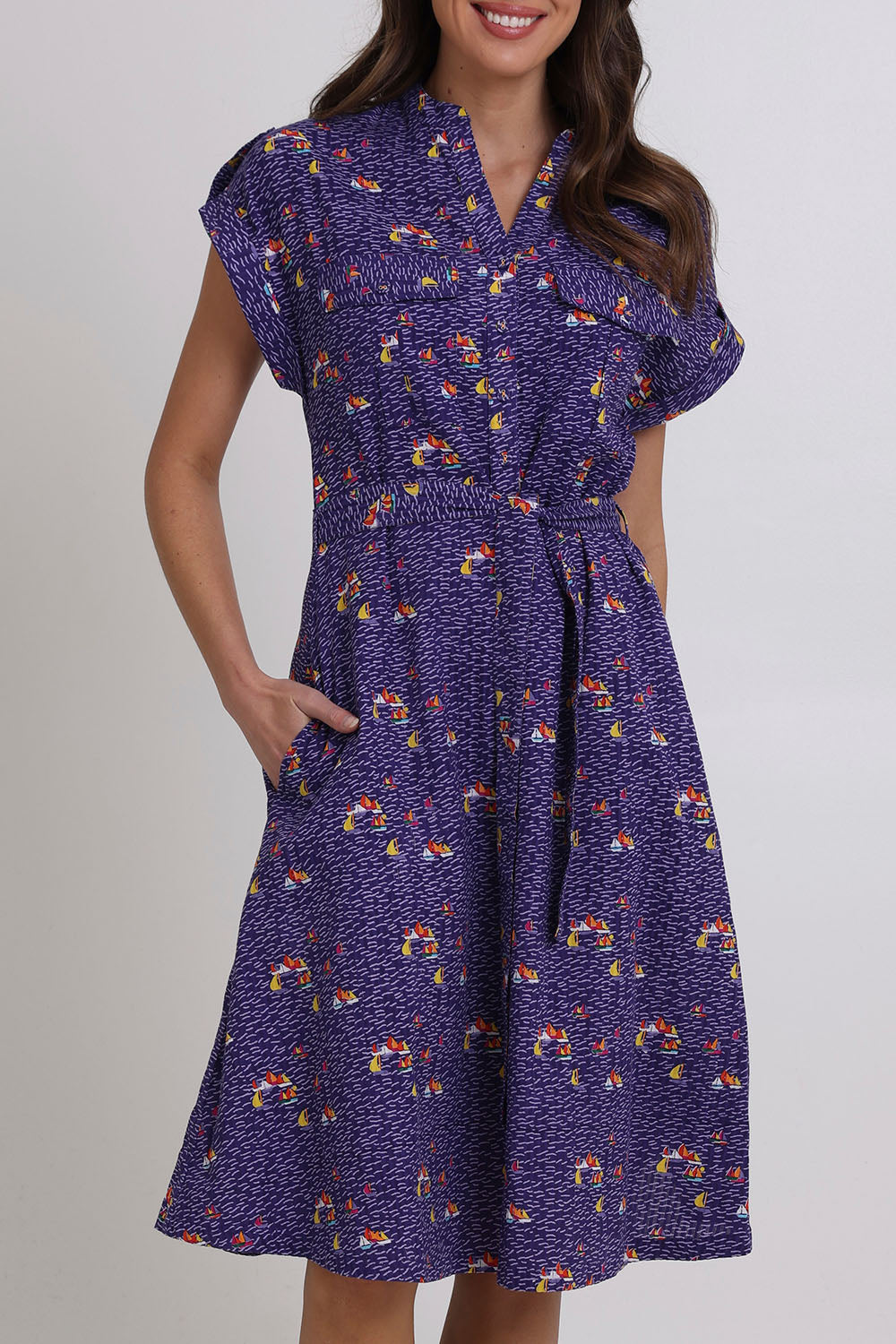 Model Madeline wearing size 10 of the Amalfi Cotton Dress in colour Amalfi (Blue), from the front, cropped image