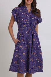Model Madeline wearing size 10 of the Amalfi Cotton Dress in colour Amalfi (Blue), from the front, cropped image
