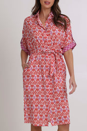 Model Madeline wearing size 10 of the Maui Cotton Shirt Dress in colour Naples (Pink), from the front, cropped image