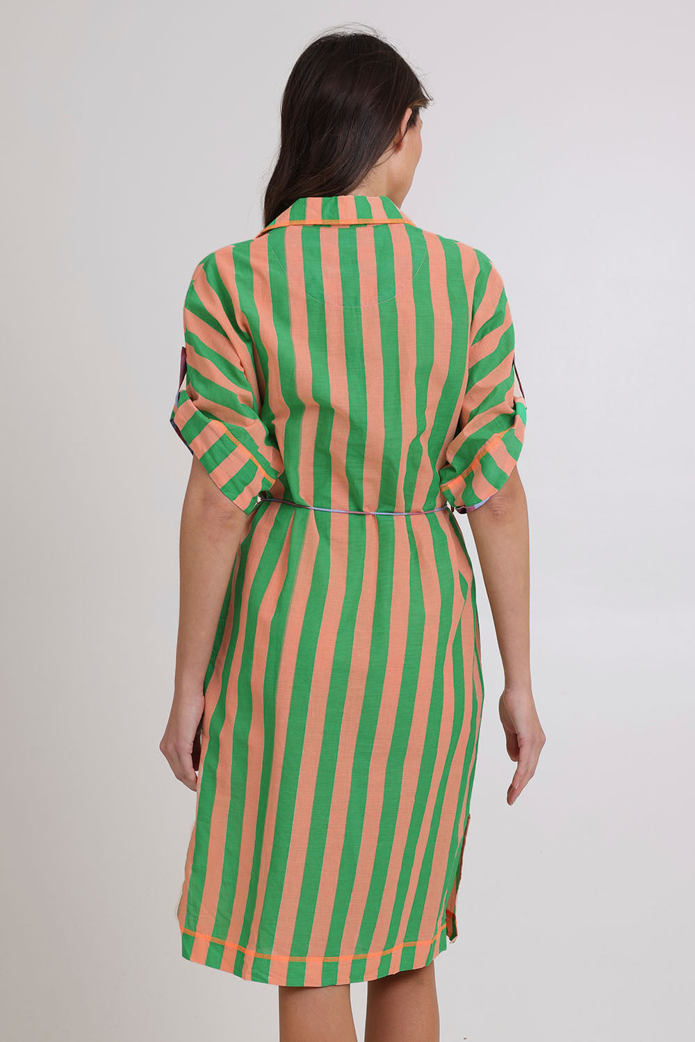 Model Madeline wearing size 10 of the Maui Cotton Shirt Dress in colour Capri (Green), from the back
