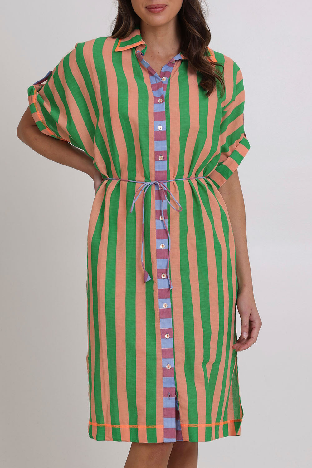 Model Madeline wearing size 10 of the Maui Cotton Shirt Dress in colour Capri (Green), from the front, cropped image