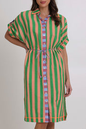 Model Madeline wearing size 10 of the Maui Cotton Shirt Dress in colour Capri (Green), from the front, cropped image