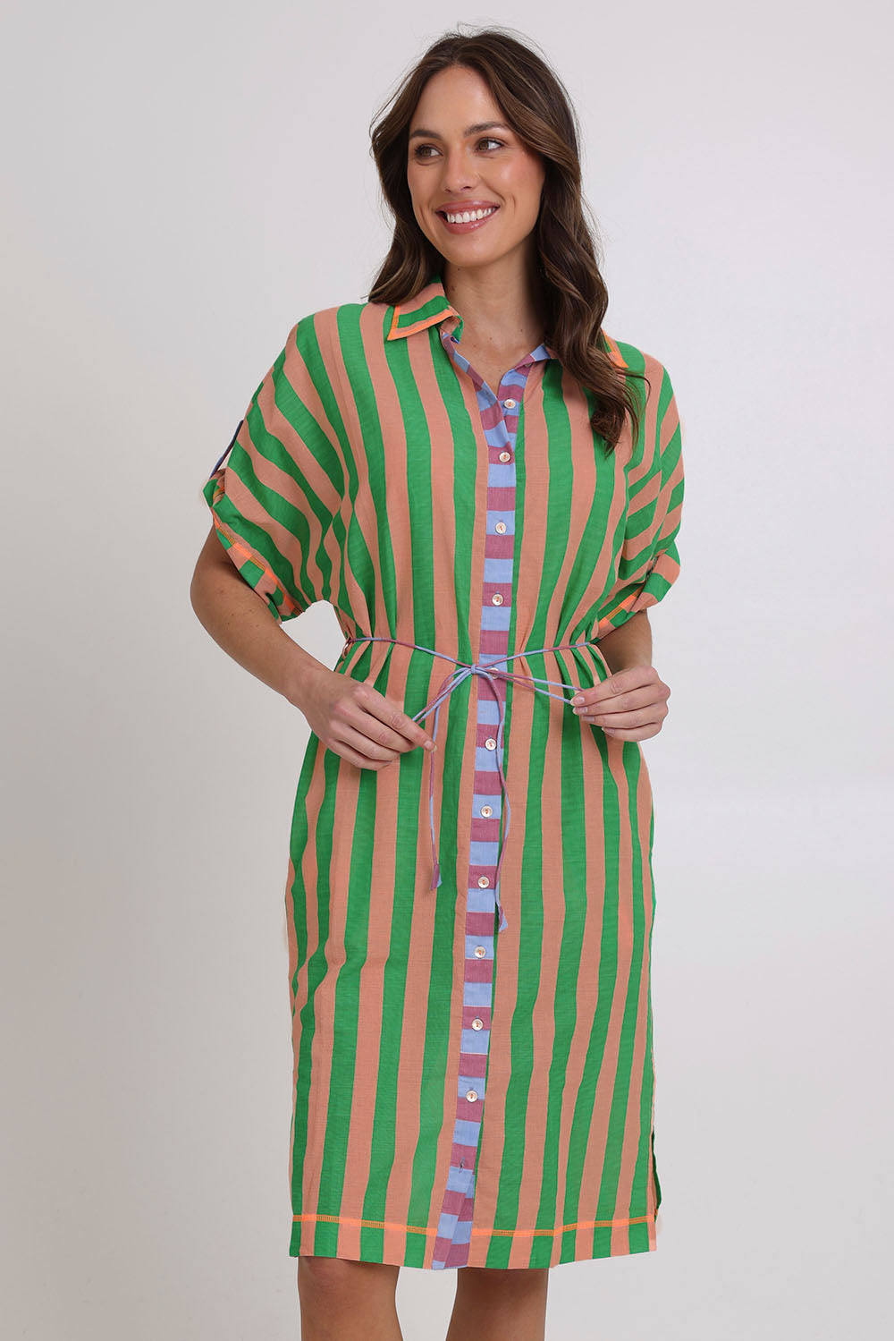 Model Madeline wearing size 10 of the Maui Cotton Shirt Dress in colour Capri (Green), from the front, cropped image