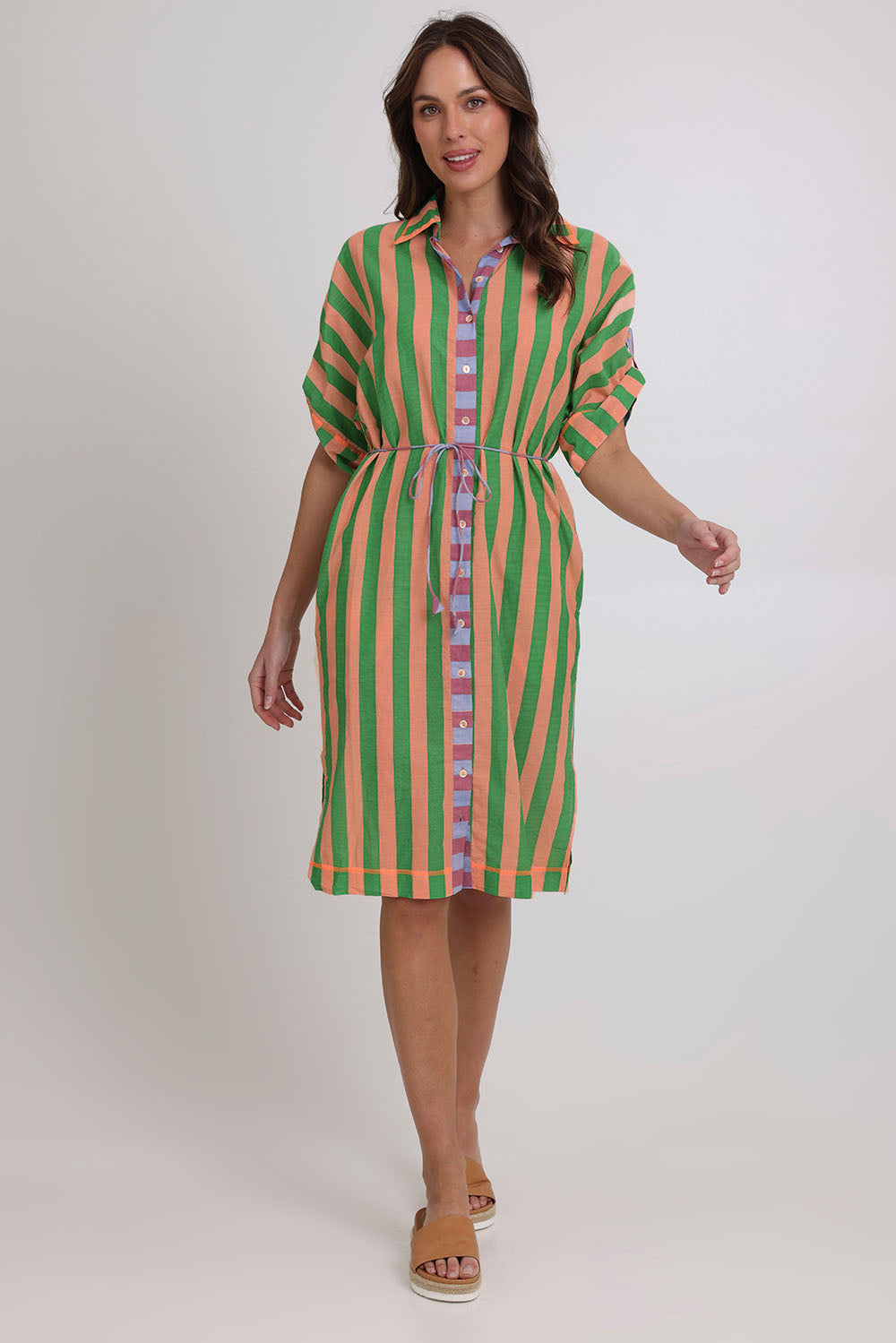 Model Madeline wearing size 10 of the Maui Cotton Shirt Dress in colour Capri (Green), from the front, showing the whole outfit