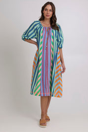 Model Madeline wearing size 10 of the Lucia Cotton Dress in colour Capris, from the front, showing the whole outfit