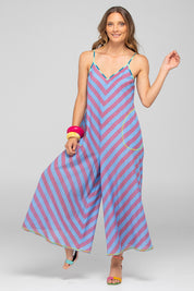 A model wearing the Shimmi Cotton Jumpsuit in colour Capriblue (Blue), from the front, showing the whole outfit