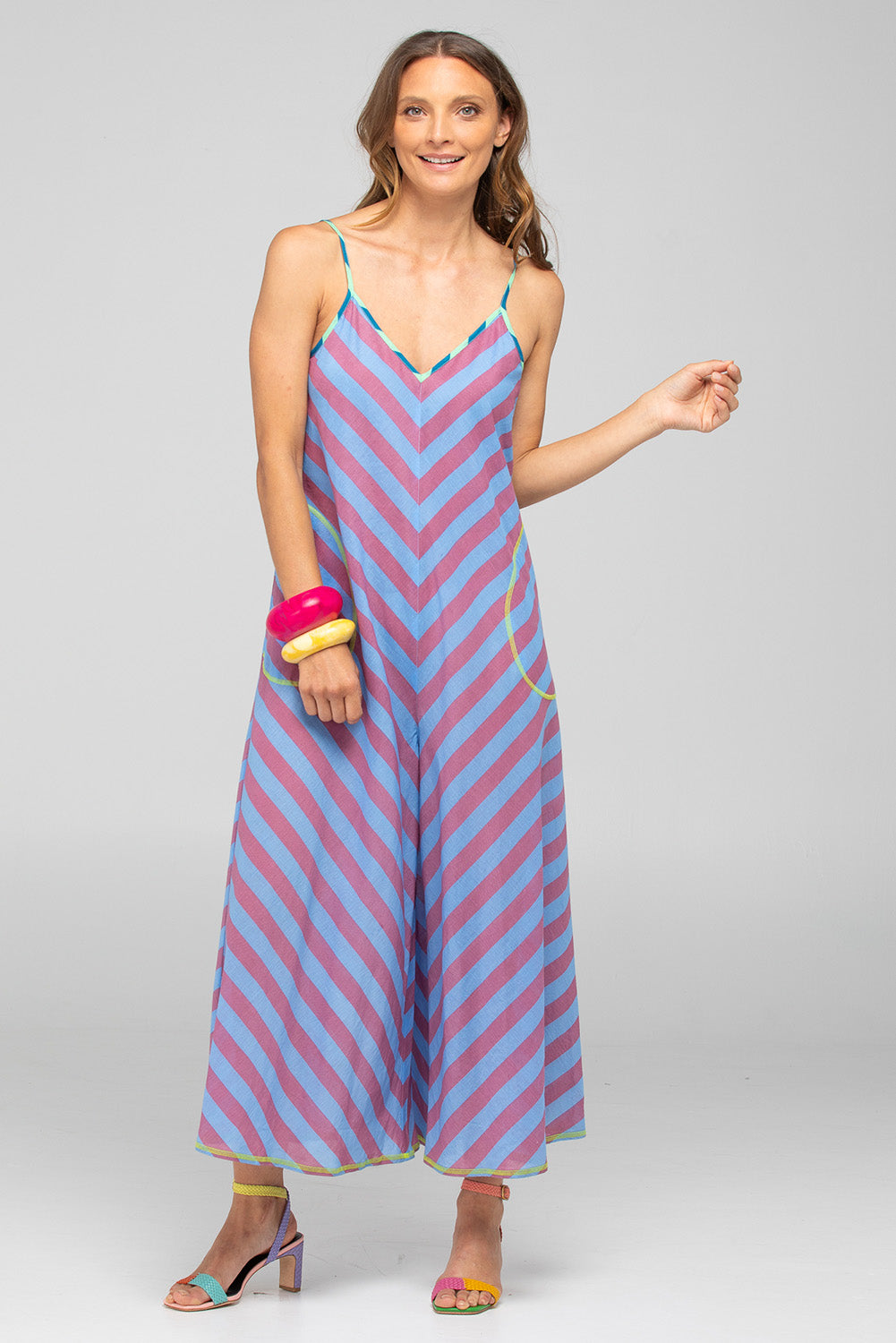 A model wearing the Shimmi Cotton Jumpsuit in colour Capriblue (Blue), from the front, showing the whole outfit