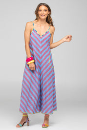 A model wearing the Shimmi Cotton Jumpsuit in colour Capriblue (Blue), from the front, showing the whole outfit