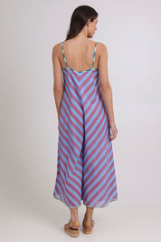 Model Madeline wearing size 10 of the Shimmi Cotton Jumpsuit in colour Capriblue (Blue), from the back