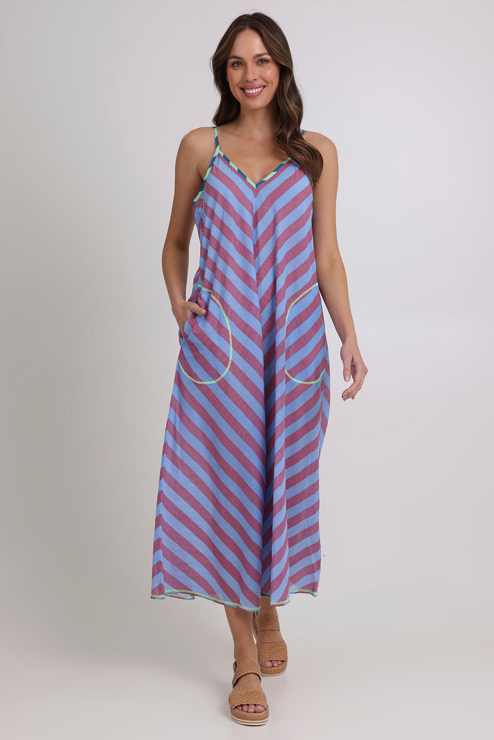 Model Madeline wearing size 10 of the Shimmi Cotton Jumpsuit in colour Capriblue (Blue), from the front, showing the whole outfit