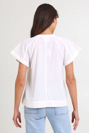 Model Madeline wearing size 10 of the Livy Cotton Top in colour White (White), from the back