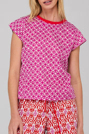 A model wearing the Leaf Cotton Top in colour Naples (Pink), from the front, showing the whole outfit