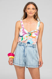 A model wearing the Juno Cotton Top in colour Sorrento, from the front, cropped image