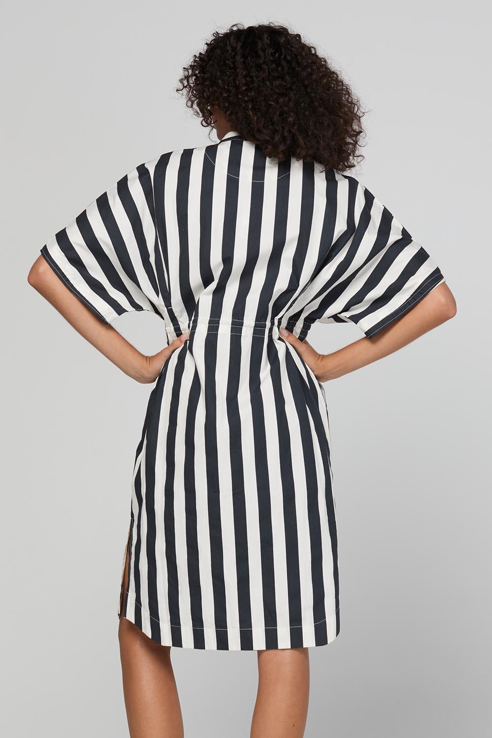 Model Genericm wearing size sample of the Shiro Shirt Dress – Mono in colour Mono, from the back