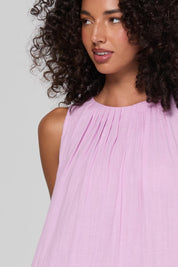 Model Genericm wearing size sample of the Oceano Dress – Sorbet in colour Sorbet, in a cropped view