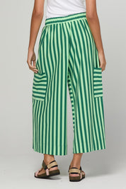 Model Genericm wearing size sample of the Luka Pant – Kiwi in colour Kiwi, from an angle