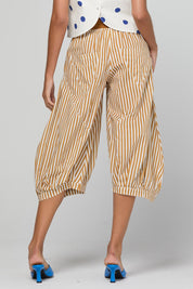 Model Genericm wearing size sample of the Guru Pant – Mustard in colour Mustard, from the front