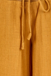 Product shot of the Guru Pant – Turmeric in colour Turmeric, showing detail