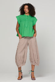 Model Genericm wearing size sample of the Guru Pant – Cocoa in colour Cocoa, from the front
