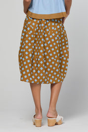 Model Genericm wearing size sample of the Guru Skirt – Geocheck in colour Geocheck, from the back