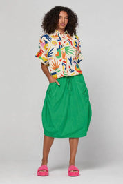 Model Genericm wearing size sample of the Guru Skirt – Apple in colour Apple, from the front