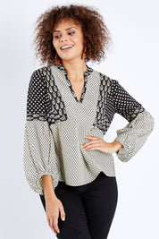 Model Lala wearing size 10 of the Stevie Top in colour Broadway (Black), from the front, cropped image