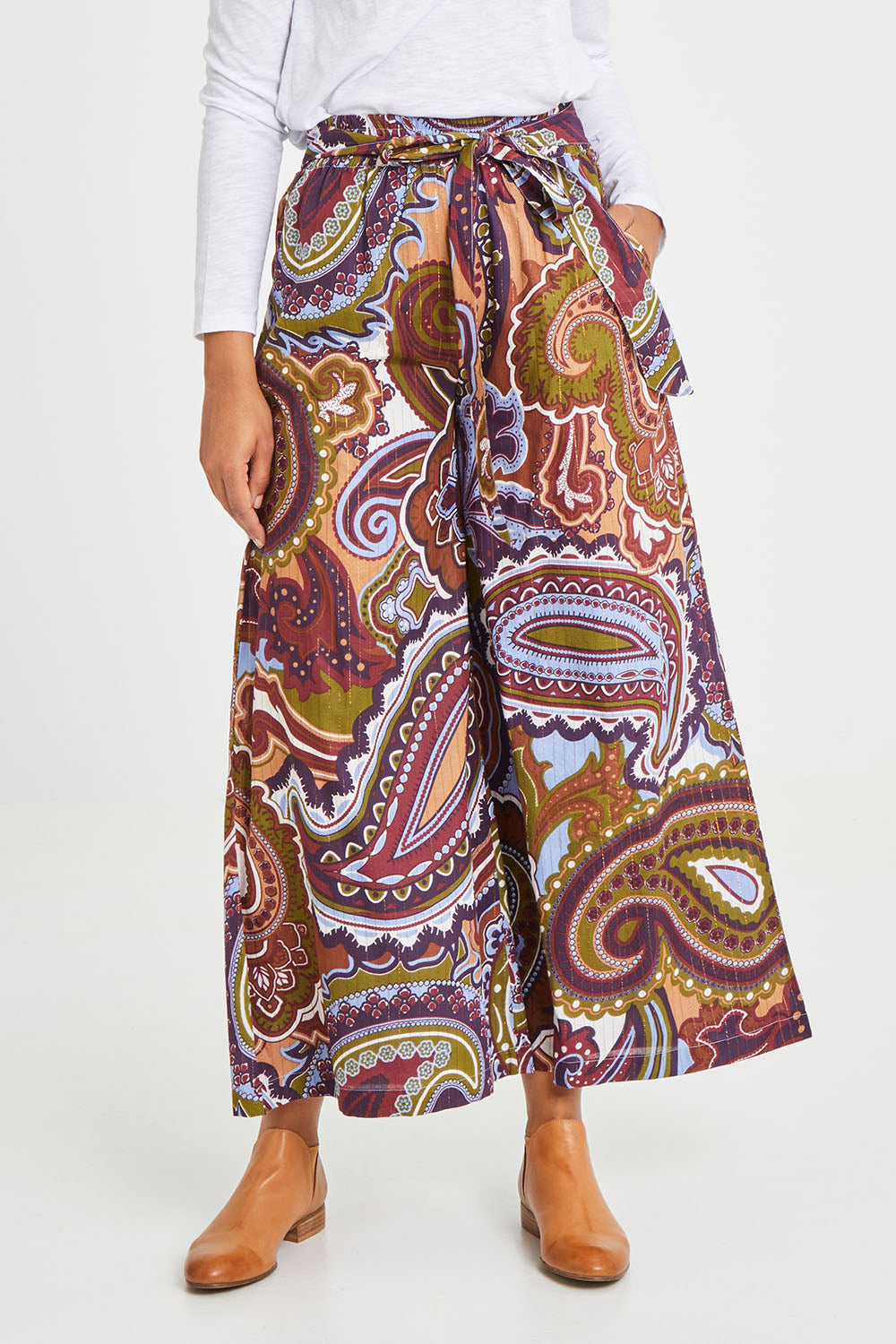 Model Olivia wearing size 10 of the Quincy Pant in colour Juniper (Green), from the front, cropped image