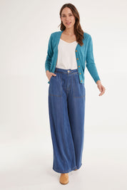 Model Madeline wearing size S of the Lora Cardigan in colour Blue (Blue), from the front, showing the whole outfit