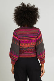 Model Olivia wearing size S of the Sofia Jumper in colour Berry (Red), from the back