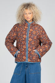 A model wearing the Cella Cotton Jacket in colour Juliette, from the front, cropped image