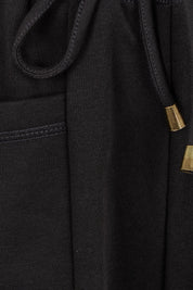 Product shot of the Guru Cotton Blend Track in colour Black (Black), detail