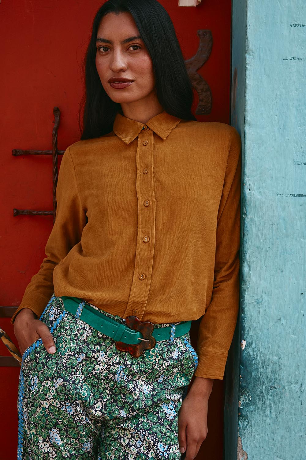 A model wearing the Metropolitan Cotton Cord Shirt in colour Marigold, from the front, showing the whole outfit