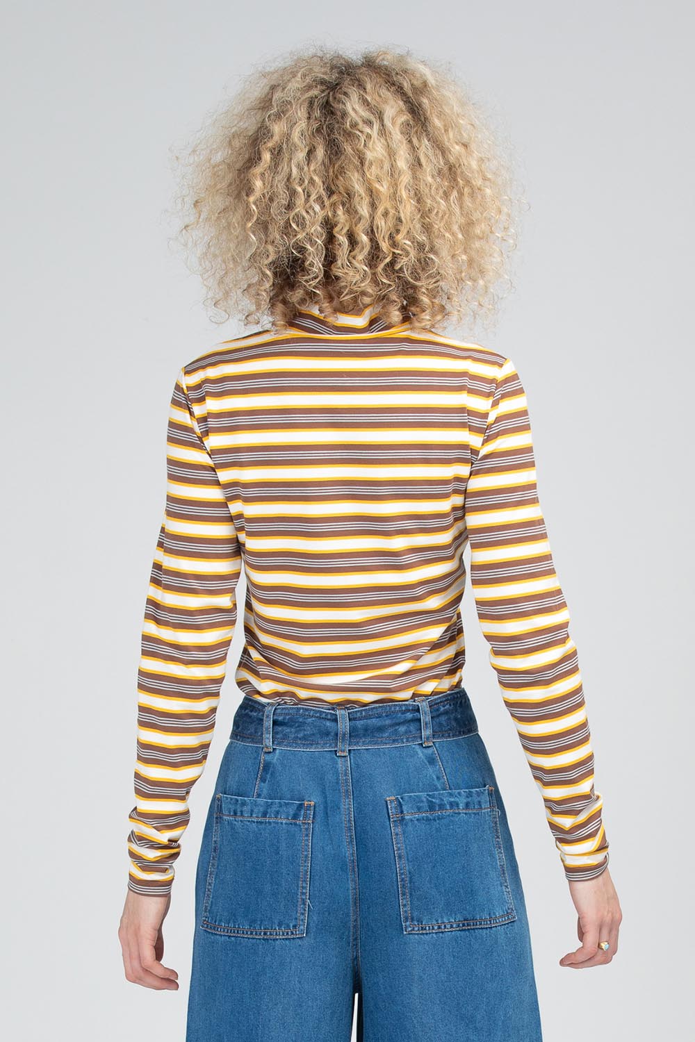 A model wearing the Stripe Cotton Skivvy in colour Stripe, from the back