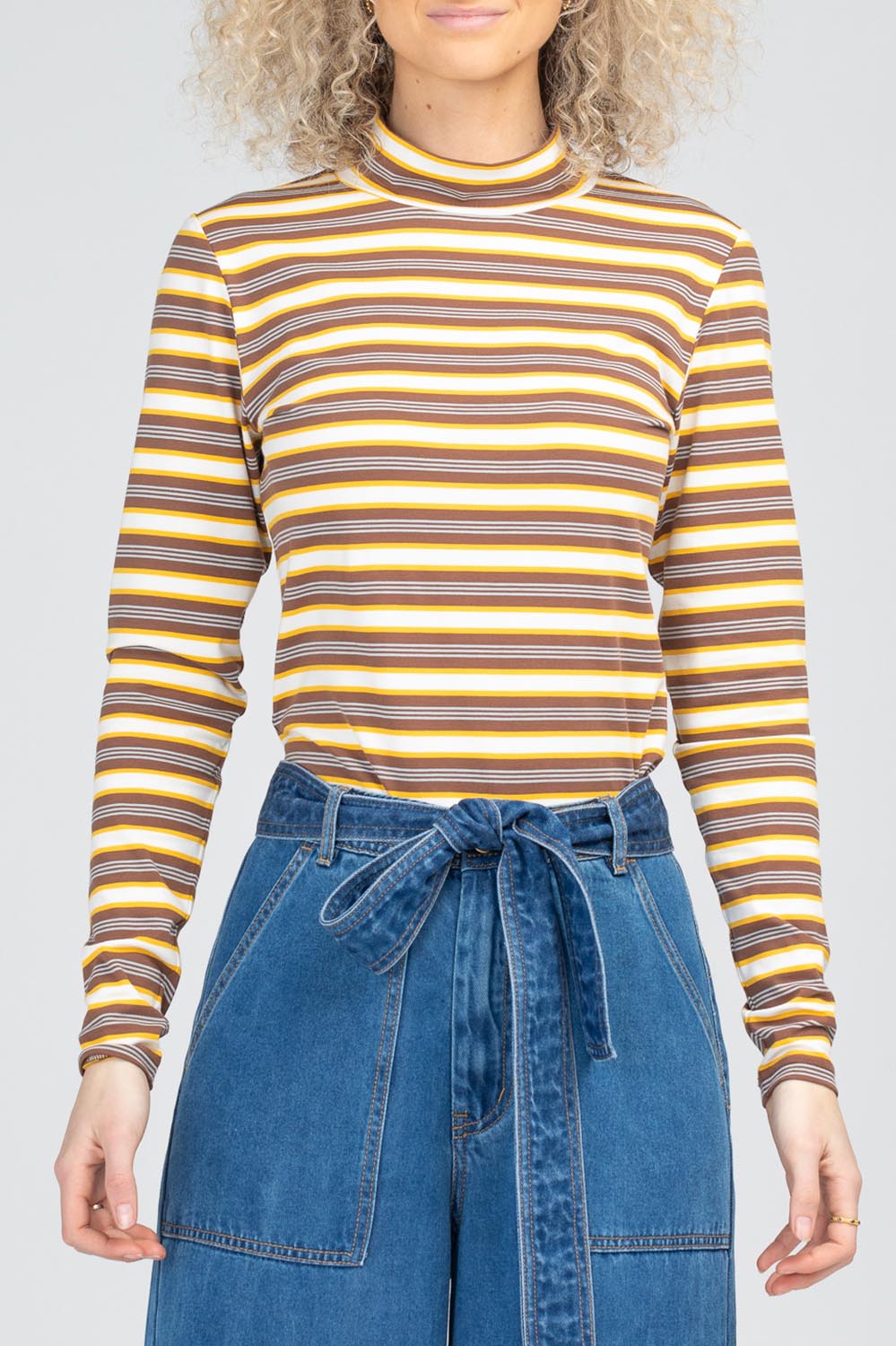 A model wearing the Stripe Cotton Skivvy in colour Stripe, from the front, cropped image