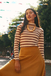 A model wearing the Stripe Cotton Skivvy in colour Stripe, from the front, showing the whole outfit