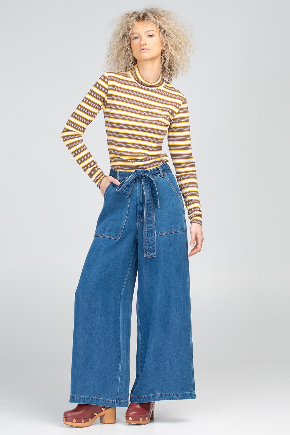 A model wearing the Stripe Cotton Skivvy in colour Stripe, from the front, showing the whole outfit
