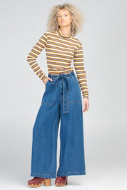 A model wearing the Stripe Cotton Skivvy in colour Stripe, from the front, showing the whole outfit