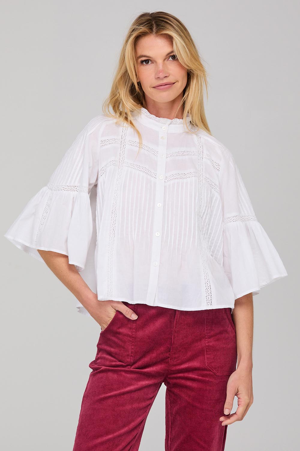 A model wearing the Haru Embroidered Shirt in colour White (White), from the front, cropped image