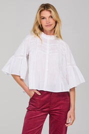 A model wearing the Haru Embroidered Shirt in colour White (White), from the front, cropped image