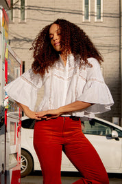 A model wearing the Haru Embroidered Shirt in colour White (White), from the front, showing the whole outfit