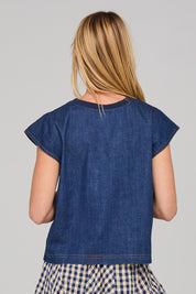 A model wearing the Leaf Top in colour Darkdenim (Blue), from the back