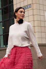 A model wearing the Saintly Knit in colour Parchment, from the front, showing the whole outfit