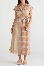 A model wearing the Portia Dress in colour Lattestrip, from the front, cropped image